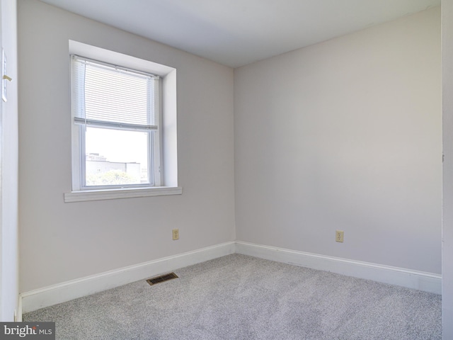 empty room with carpet flooring