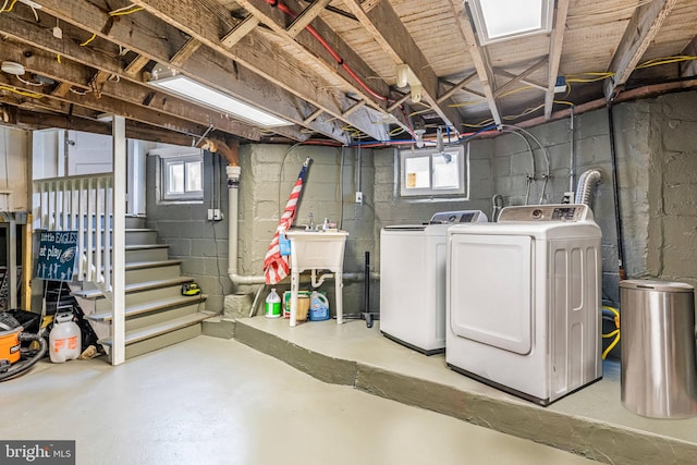 basement featuring washing machine and clothes dryer