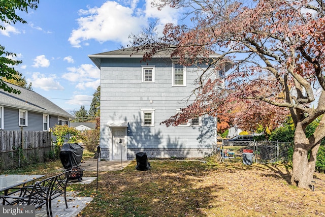 rear view of property with a patio