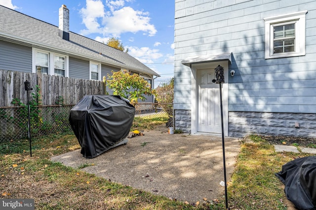 view of patio featuring a grill