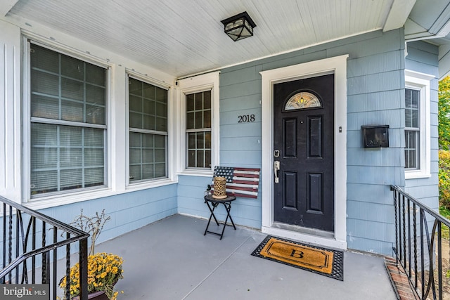 property entrance featuring covered porch