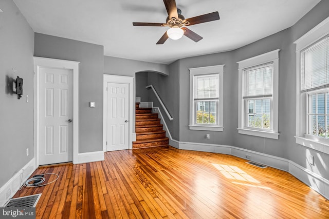 unfurnished room with wood-type flooring and ceiling fan