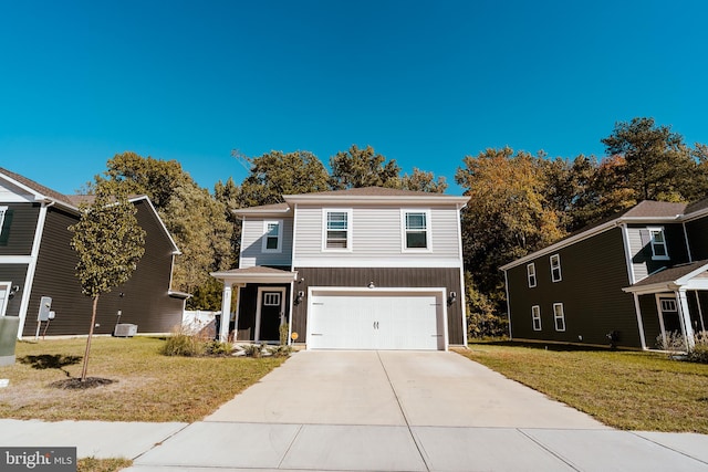 view of front property featuring central air condition unit, a front yard, and a garage