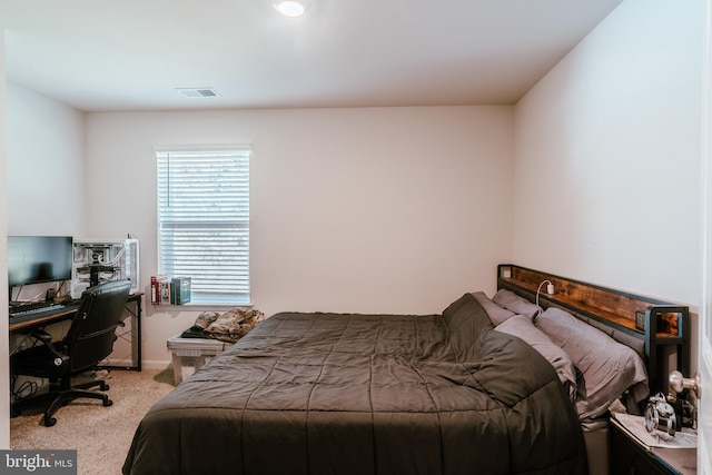 bedroom featuring light carpet