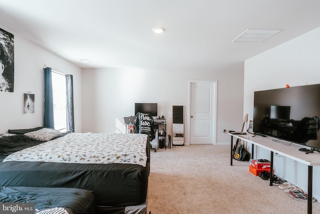 bedroom with light colored carpet