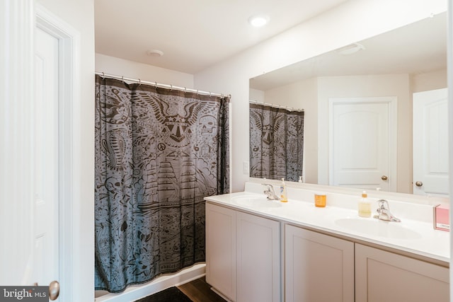 bathroom with vanity and curtained shower