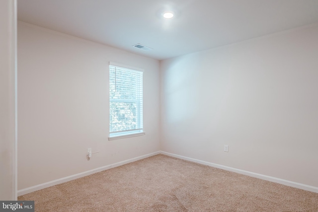 empty room with carpet flooring