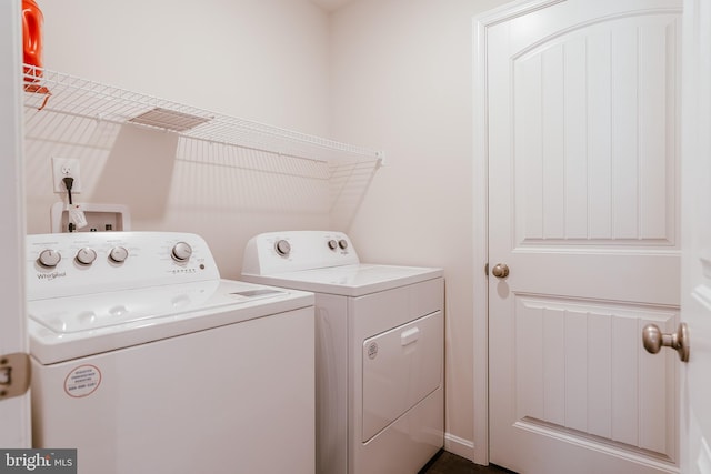 laundry area with washing machine and dryer