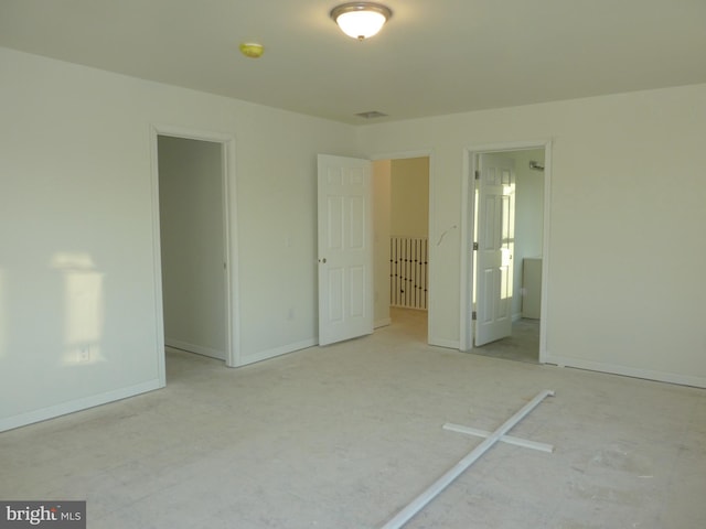 unfurnished bedroom featuring baseboards