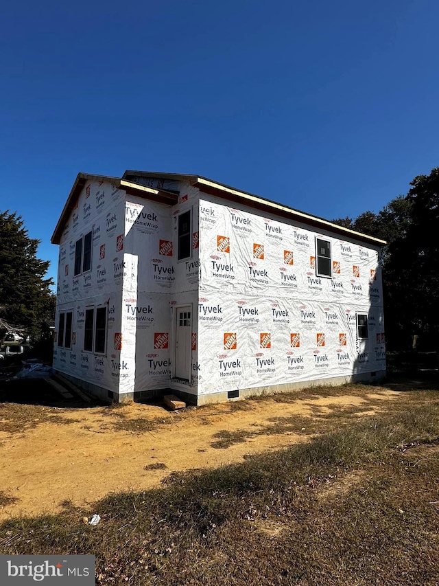 view of home's exterior with crawl space