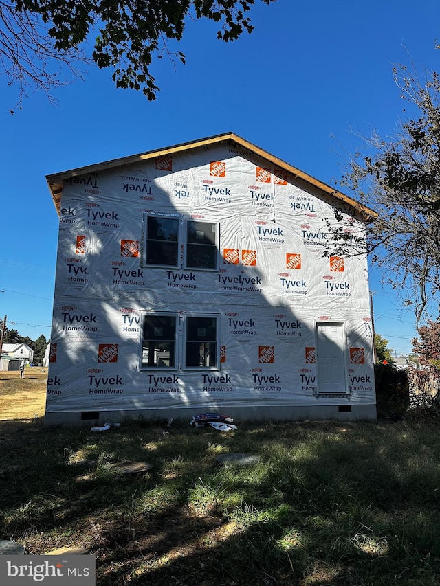 view of side of home with crawl space