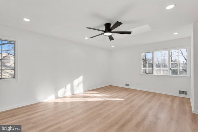 spare room with recessed lighting, visible vents, and light wood-style flooring