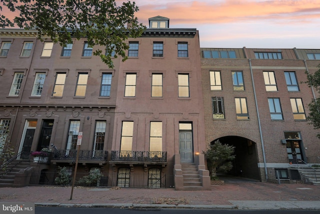 view of outdoor building at dusk