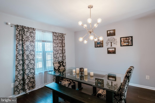 dining room featuring a notable chandelier and dark hardwood / wood-style floors