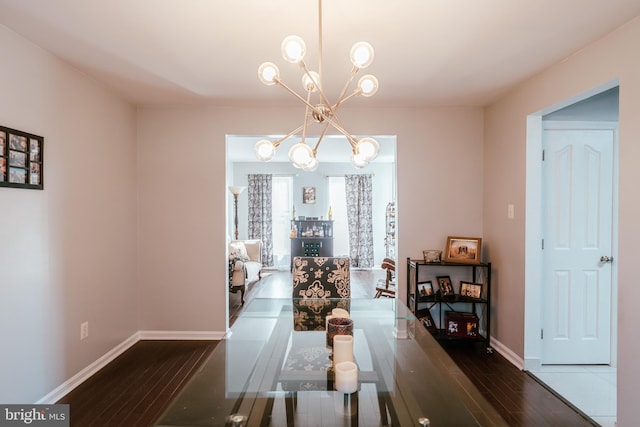 dining area featuring a chandelier and dark hardwood / wood-style flooring