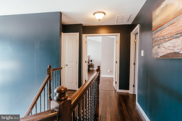 corridor featuring dark wood-type flooring