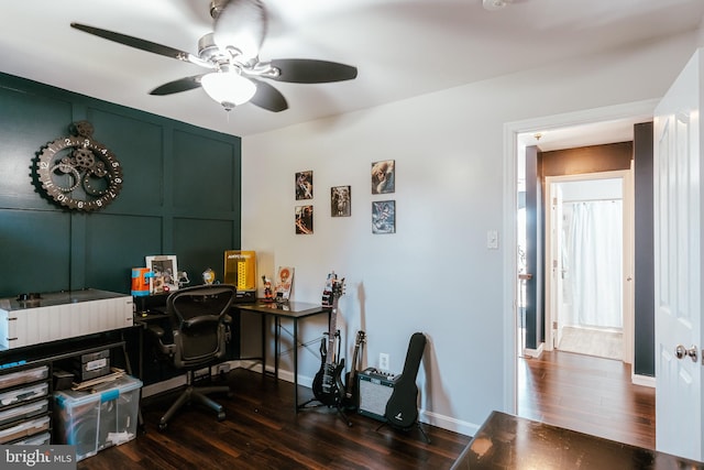 office space with ceiling fan and dark hardwood / wood-style floors