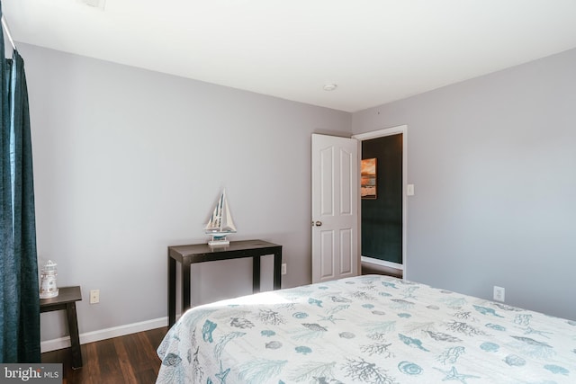 bedroom featuring dark hardwood / wood-style floors