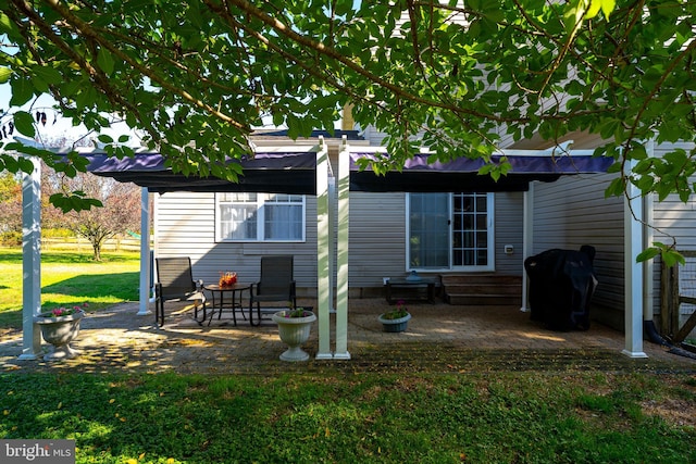 back of property with a patio and a lawn