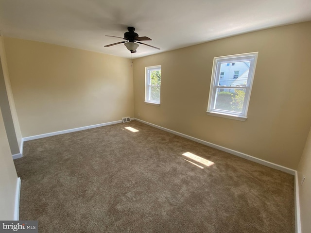 carpeted empty room with ceiling fan