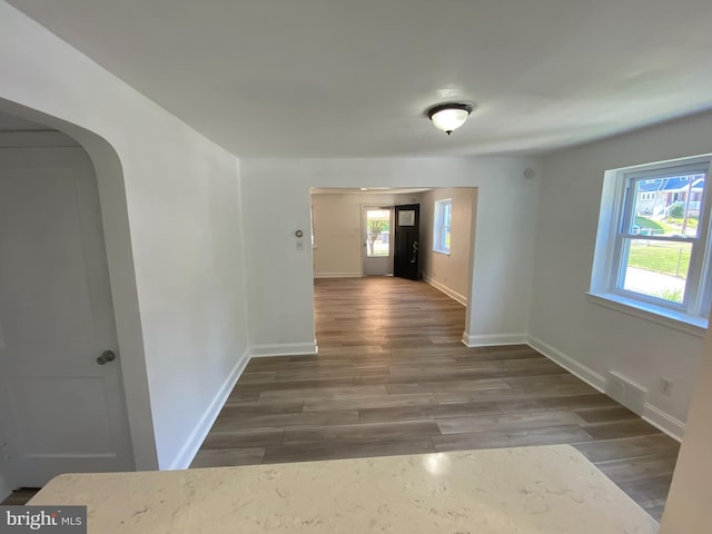 hall with dark hardwood / wood-style flooring