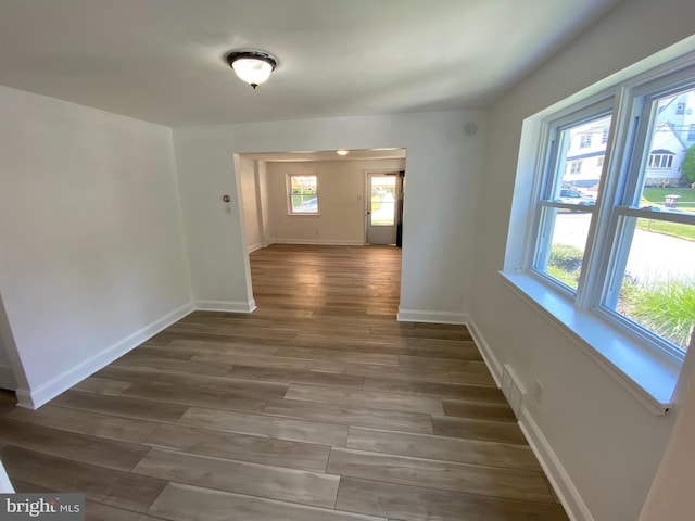 hallway featuring dark hardwood / wood-style flooring