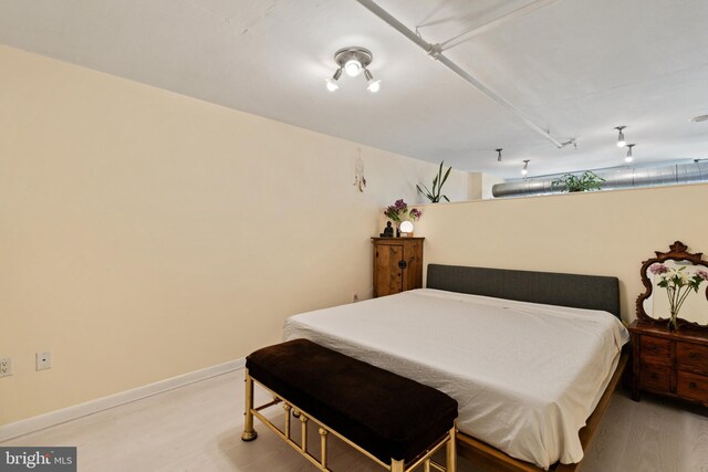 bedroom featuring hardwood / wood-style flooring