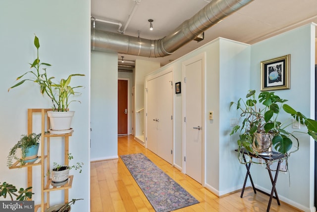 corridor featuring hardwood / wood-style flooring