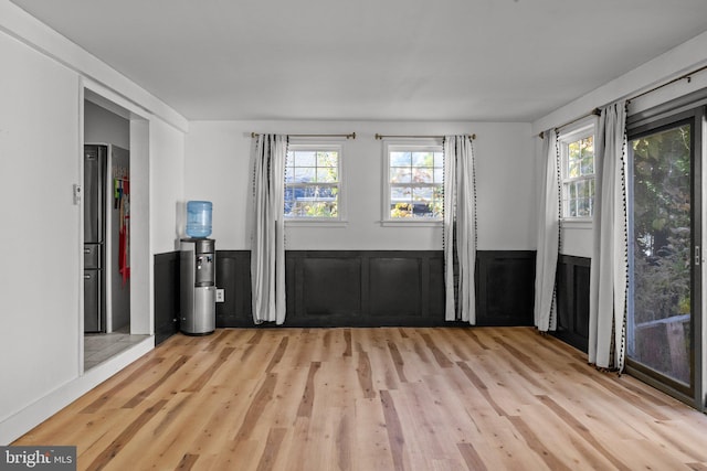 empty room with light hardwood / wood-style floors