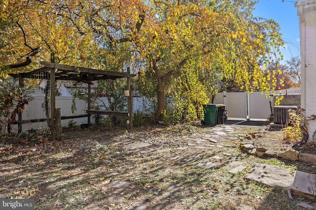 view of yard with central AC unit