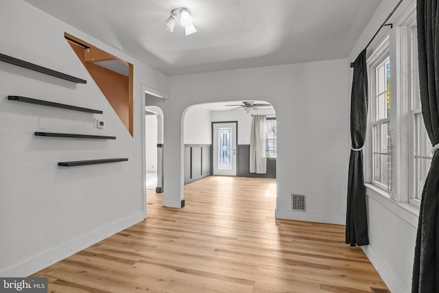 foyer with ceiling fan, light hardwood / wood-style floors, and plenty of natural light