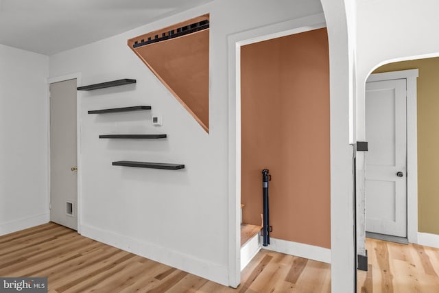 staircase with wood-type flooring