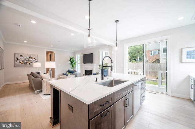 1453 N Lancaster St, Arlington, VA 22205 - kitchen featuring a sink, light wood finished floors, baseboards, recessed lighting, and a fireplace