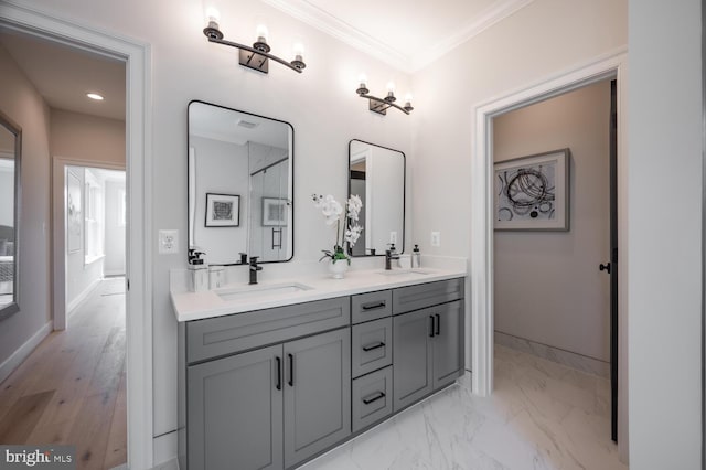 1453 N Lancaster St, Arlington, VA 22205 - bathroom with double vanity, baseboards, crown molding, marble finish floors, and recessed lighting