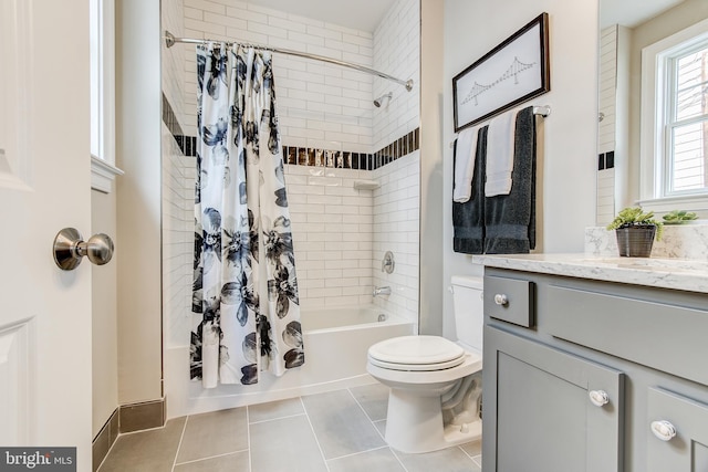 full bathroom featuring toilet, vanity, shower / bathtub combination with curtain, and tile patterned floors