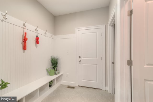 mudroom with light tile patterned floors