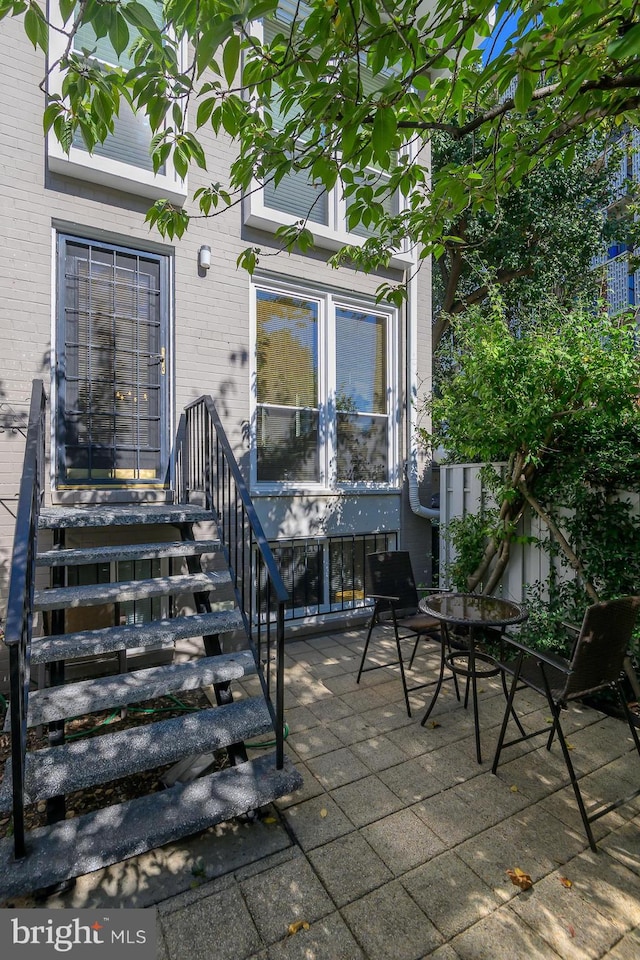 doorway to property with a patio area