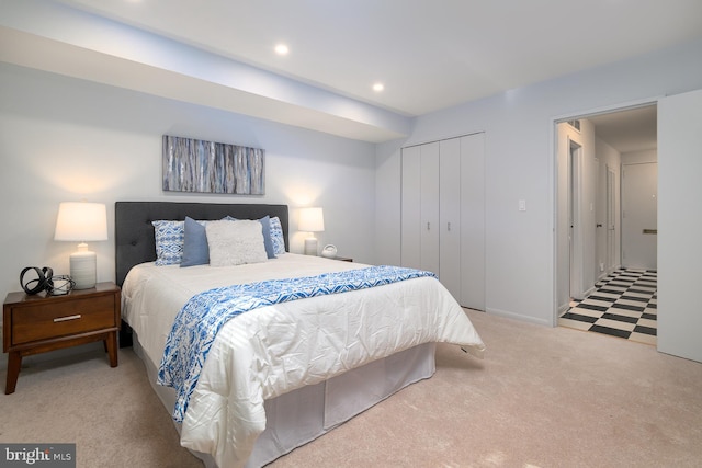 carpeted bedroom with a closet