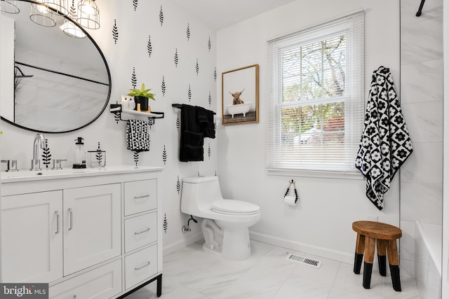 bathroom featuring vanity and toilet