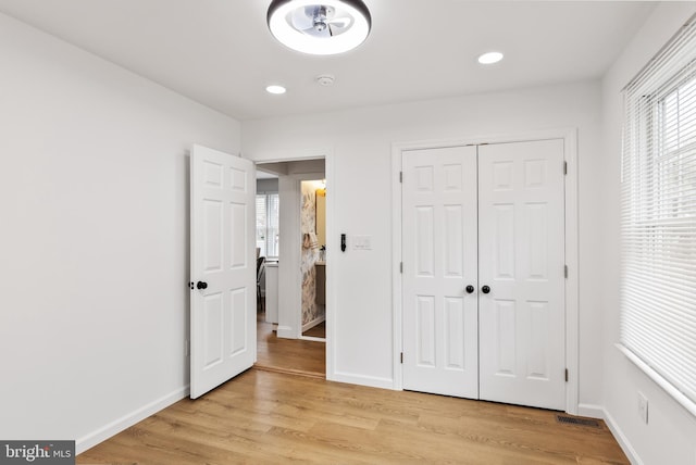 119 E Camden Ave, Moorestown, NJ 08057 - unfurnished bedroom featuring multiple windows, light wood-style flooring, baseboards, and recessed lighting