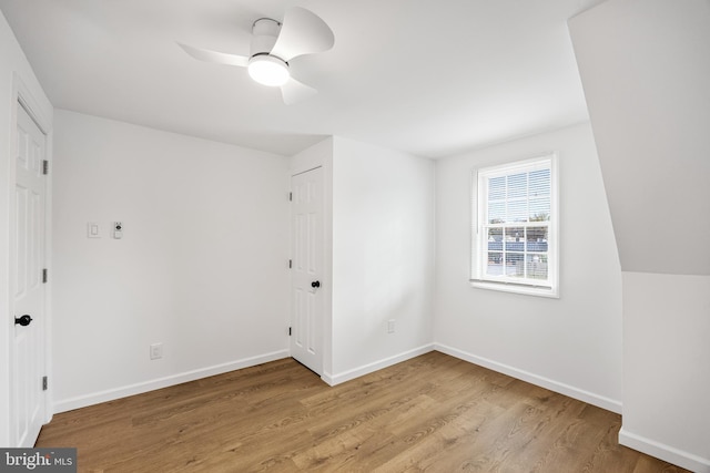 interior space with wood-type flooring and ceiling fan