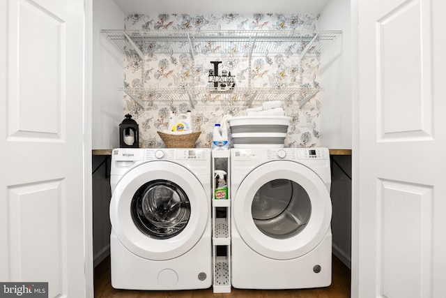 washroom featuring washer and dryer and dark hardwood / wood-style flooring