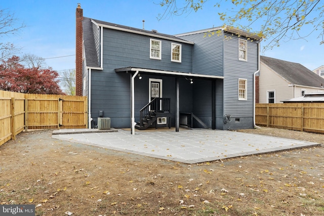 119 E Camden Ave, Moorestown, NJ 08057 - rear view of house with a patio, a chimney, a fenced backyard, and central AC