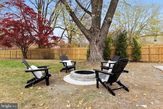 view of yard with a fire pit