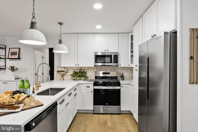 119 E Camden Ave, Moorestown, NJ 08057 - kitchen with stainless steel appliances, a sink, tasteful backsplash, recessed lighting, and white cabinetry