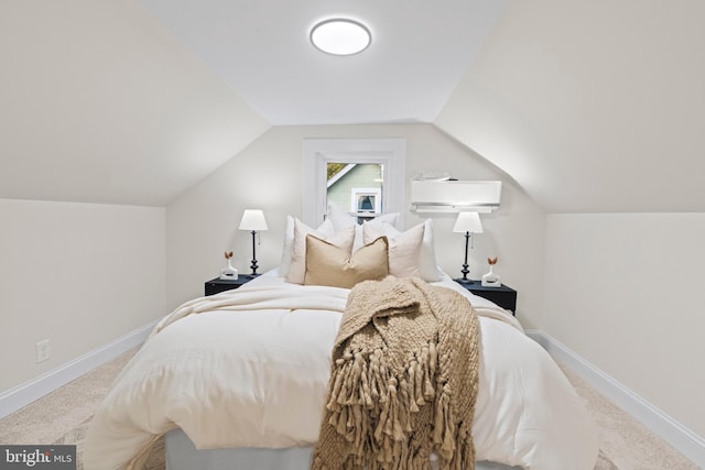 bedroom with vaulted ceiling and light colored carpet