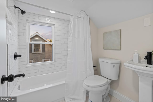 full bathroom featuring toilet, shower / bath combination with curtain, sink, and tile patterned flooring