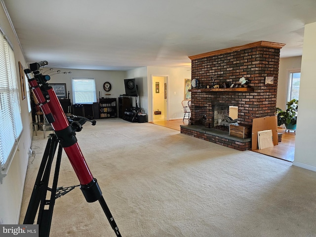 unfurnished living room with a brick fireplace and light colored carpet