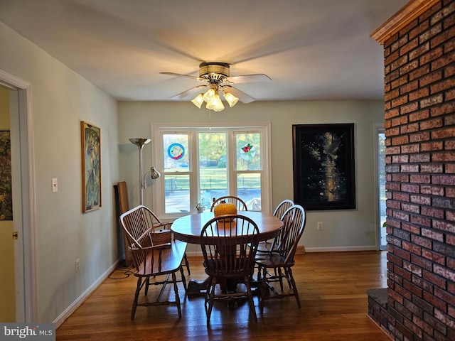 dining area featuring dark hardwood / wood-style floors and ceiling fan