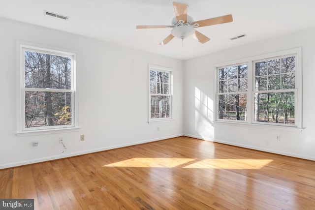 unfurnished room featuring ceiling fan and light wood-type flooring